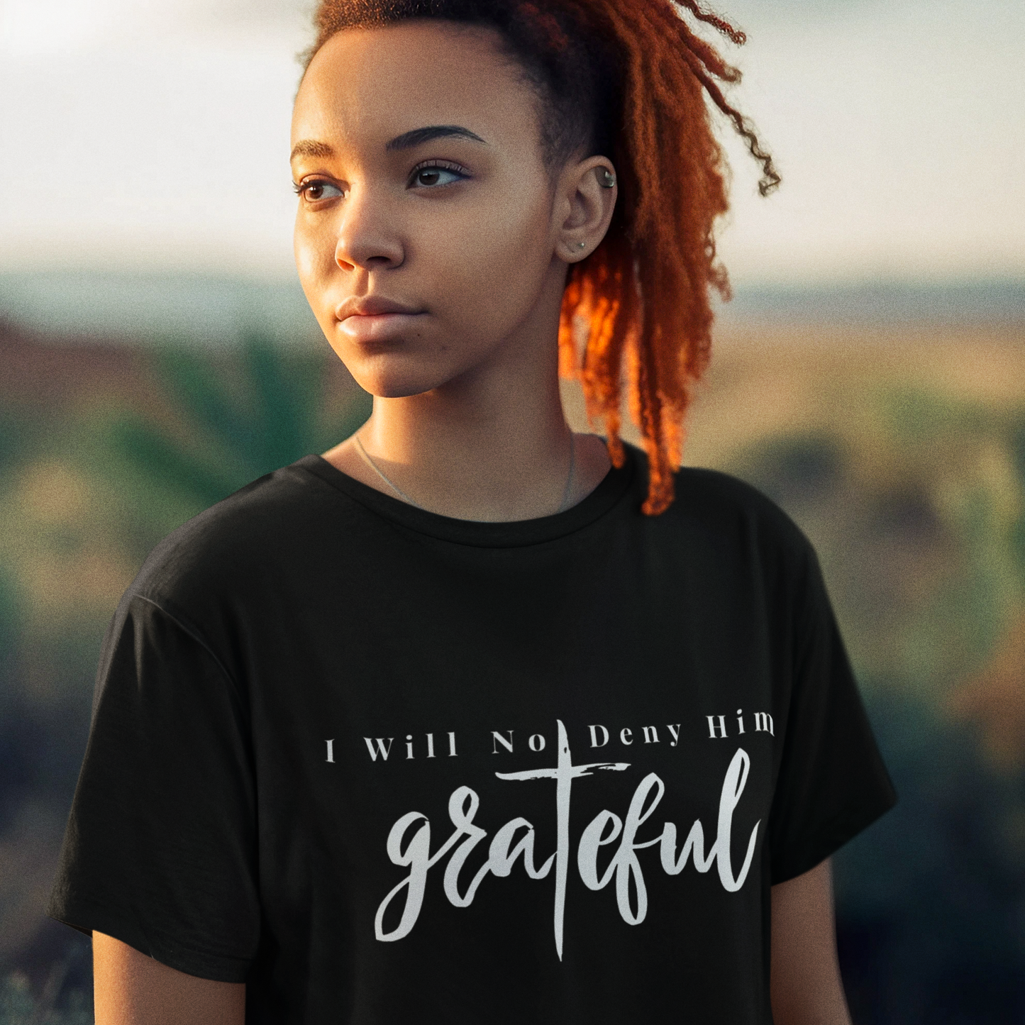 Tryphena "Grateful" Black T-Shirt with bold white text. Proclaim your gratitude with confidence (Matthew 10:33). A statement of faith and positivity.