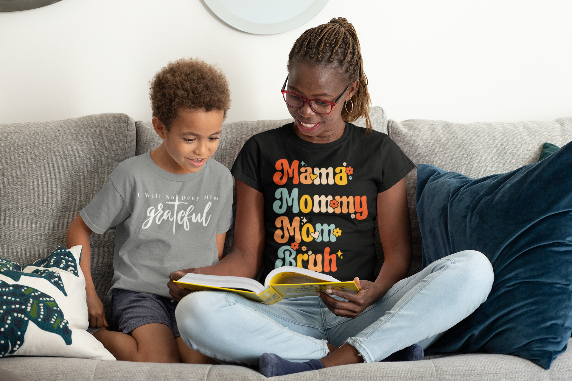 Tryphena "Mama Mommy Mom Bruh" Sage T-Shirt. A humorous and relatable tee for moms. From "Mama" to "Bruh," this black shirt is a reminder you're doing great!