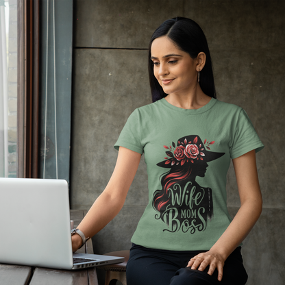 Tryphena "Wife Mom Boss" Sage T-Shirt. A stylish reminder of your power in faith. You're a Wife, Mom, Boss, and so much more (Proverbs 31:25-31). This sage tee celebrates your journey.